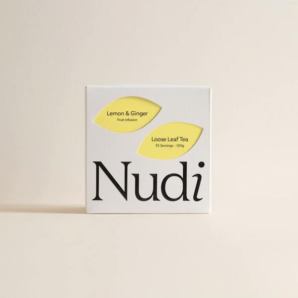 Lemon and ginger luxury tea box with bold yellow accents, decorated for a vibrant look.