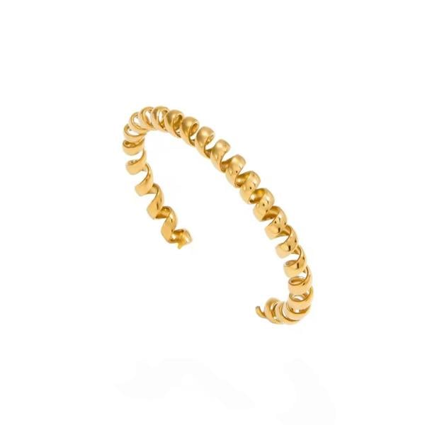 Gold spiral ring on a white background