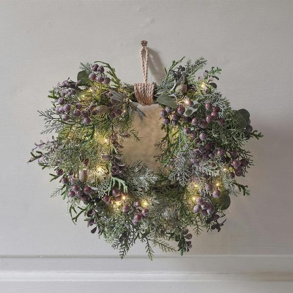 40cm pre-lit purple berry heart wreath with warm LED lights, frosted grapes, and fir cones on a woven twig base with a hessian hanging loop.