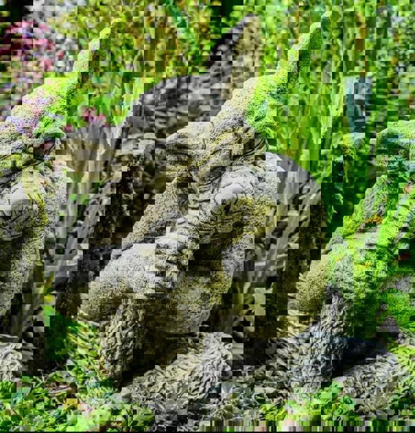 Solid cast Stone Dog Gargoyle In Sleepy Pose