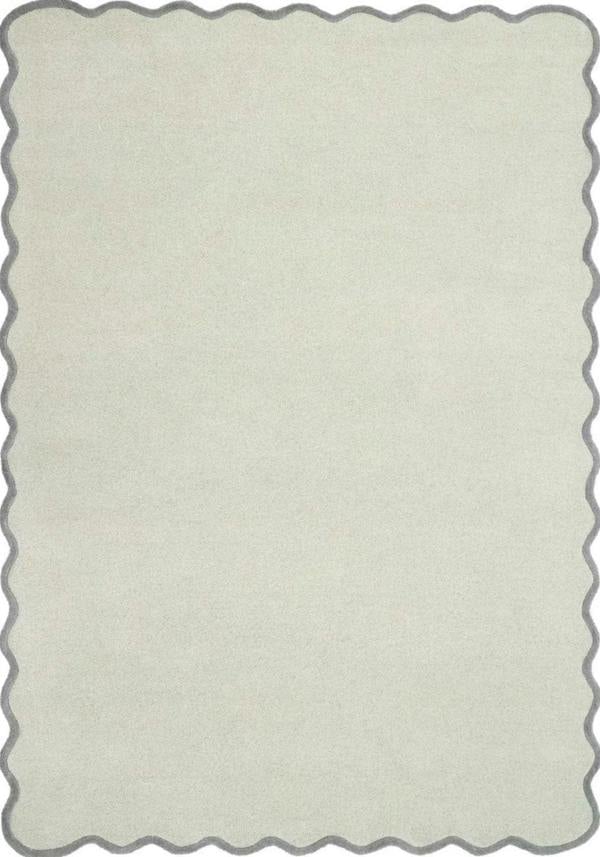 Rectangular area rug with scalloped edge in a light gray color on a white background