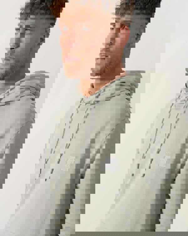 Model wearing BOSS Orange Wetalk Mens Pullover Hoodie With Logo Patch in Silver 043 - Detail