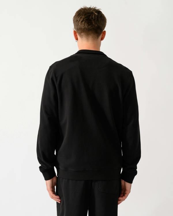 back shot of a model wearing a Belstaff Mens Logo Full Zip Sweatshirt in Black