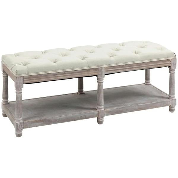 Cream upholstered 2-tier bed end bench with tufted seat and lower storage shelf