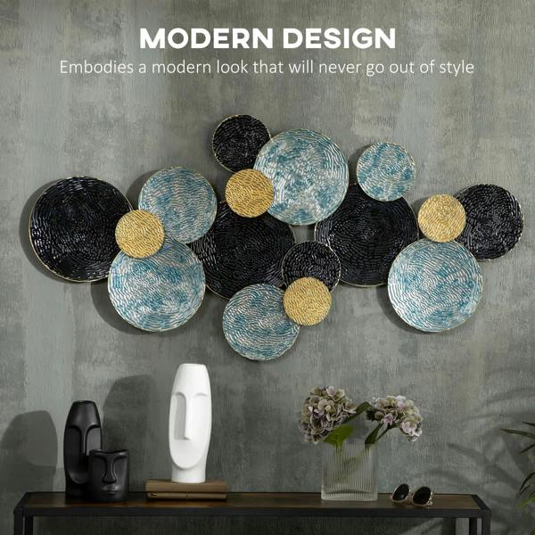 Metal hanging circle wall art cluster featuring textured black, blue, and gold discs