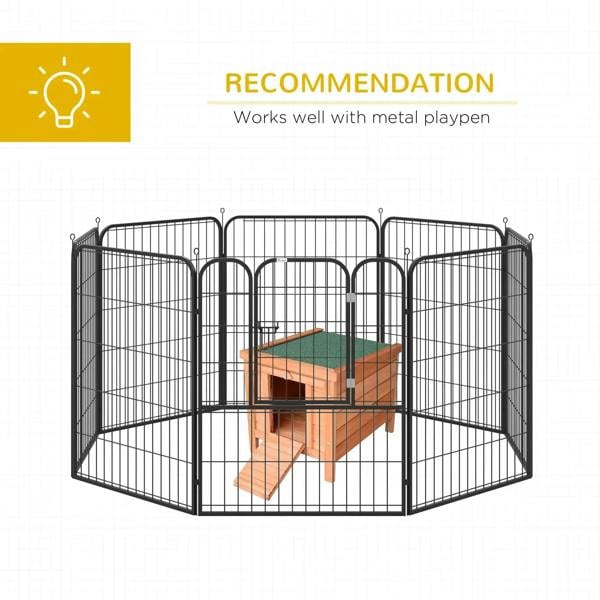 Small wooden hutch placed inside a metal playpen enclosure