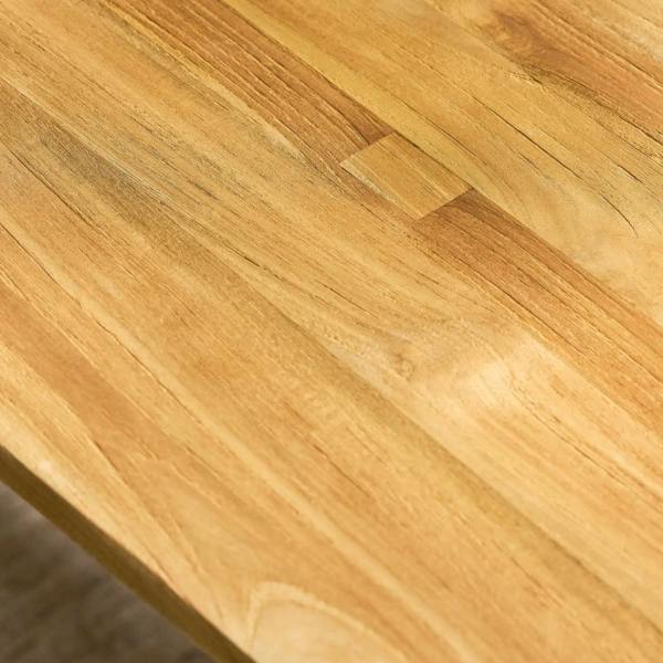 Close-up of the natural live edge and wood grain on the tabletop.