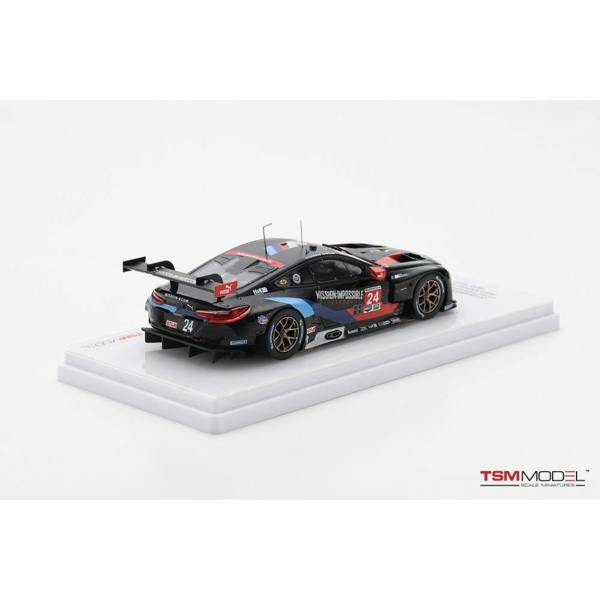 a black race car on a white surface