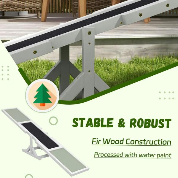 Close-up of white wooden dog seesaw frame with textured black anti-slip surface on deck