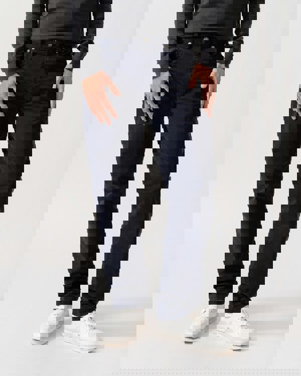 Model is wearing GANT Mens Regular Fit Desert Jeans in 433 Evening Blue - Front