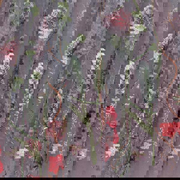 Embroidered fabric with floral and leaf patterns on a gray background