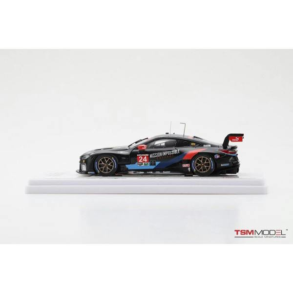 a black race car on a white surface