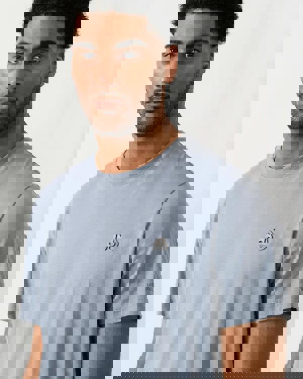 close up shot of a model wearing a Moose Knuckles Crescent Mens T-Shirt in Jet Stream 1884