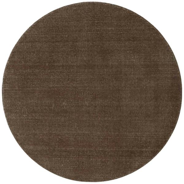 Round brown rug with a textured surface on a white background