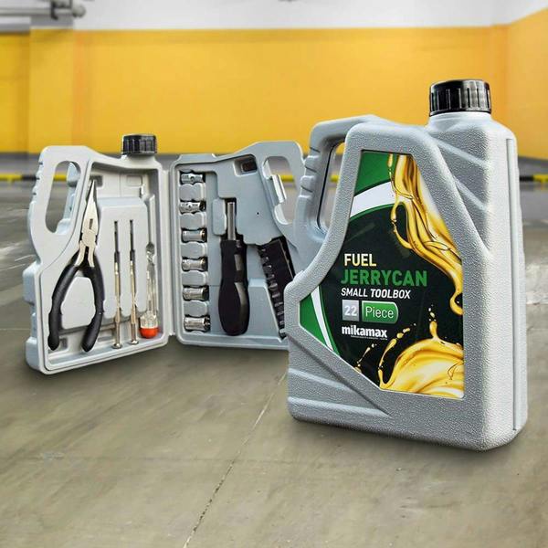 A grey plastic novelty toolbox shaped like an oil jerrycan sitting on a concrete floor. The front canister shows a green and yellow 'FUEL JERRYCAN SMALL TOOLBOX' label, while a second open canister behind it displays the organized 22-piece tool set including pliers, sockets, and screwdrivers.