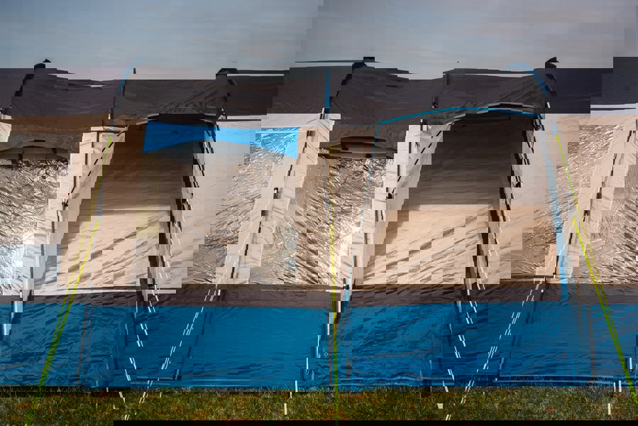 The side of the OLPRO Cocoon V2 Campervan Awning, showing the peak canopy and the side door, closed.