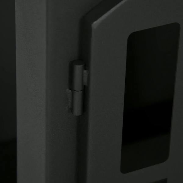 Black bioethanol stove door hinge and latch detail on front panel