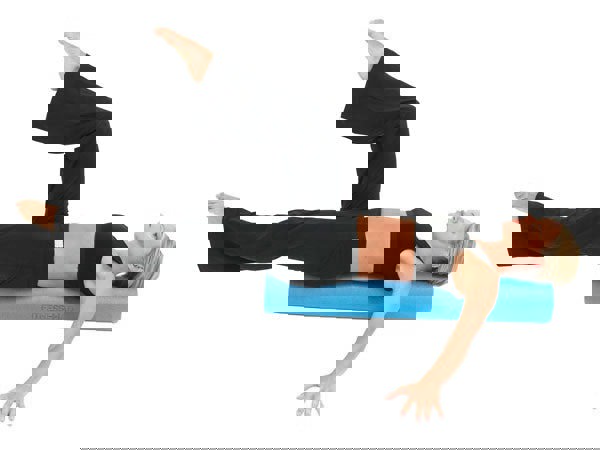 Woman using a Fitness Mad Foam Roller 90cm