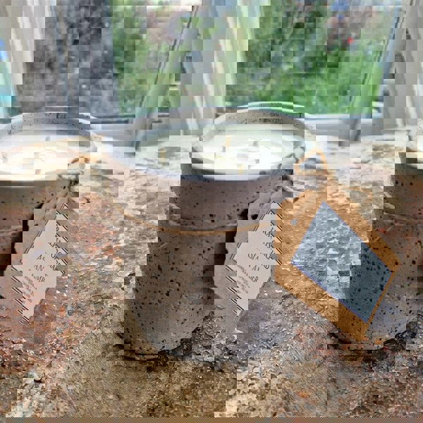 candle in cement pot