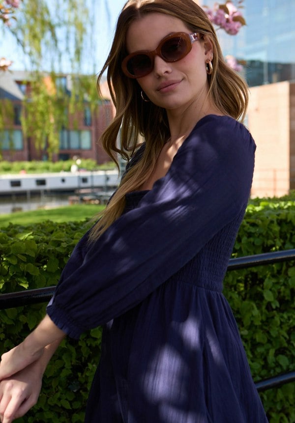 lifestyle image with model wearing Pippa Shirred Bodice Maxi Dress In Navy - image 1
