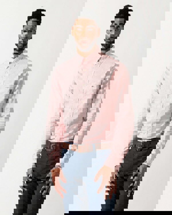 Model wearing a GANT Mens Regular Fit Classic Poplin Gingham Shirt in Washed Pink