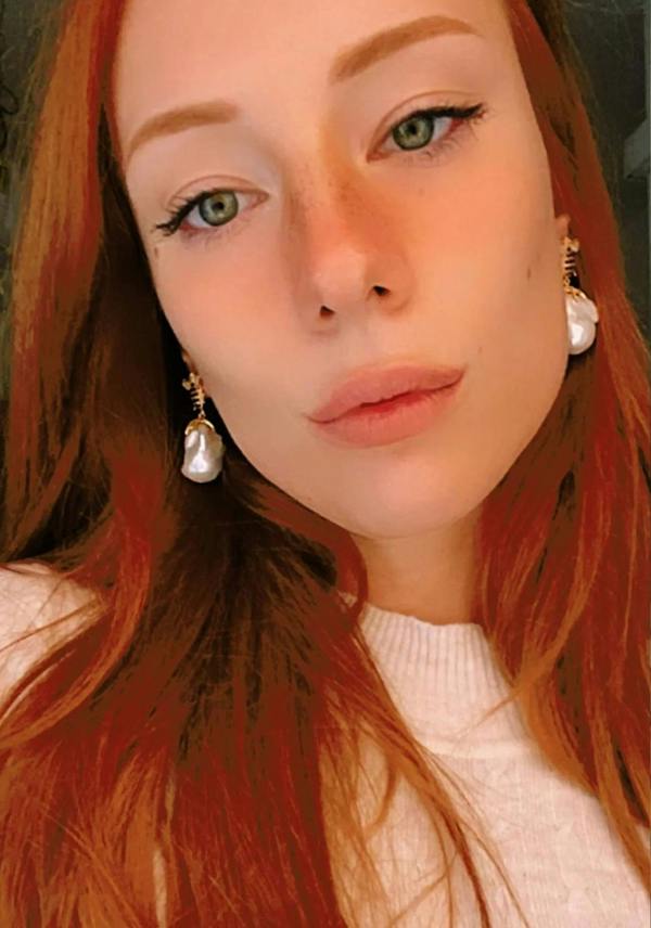 The earring worn by a model.