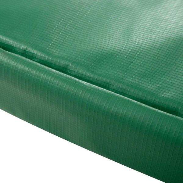 Green trampoline pad edge with textured fabric and stitched seam, thick padding