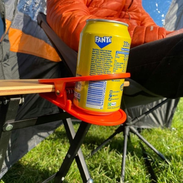 Orange Drink Holder Table Clip OLPRO - with can on table edge in field