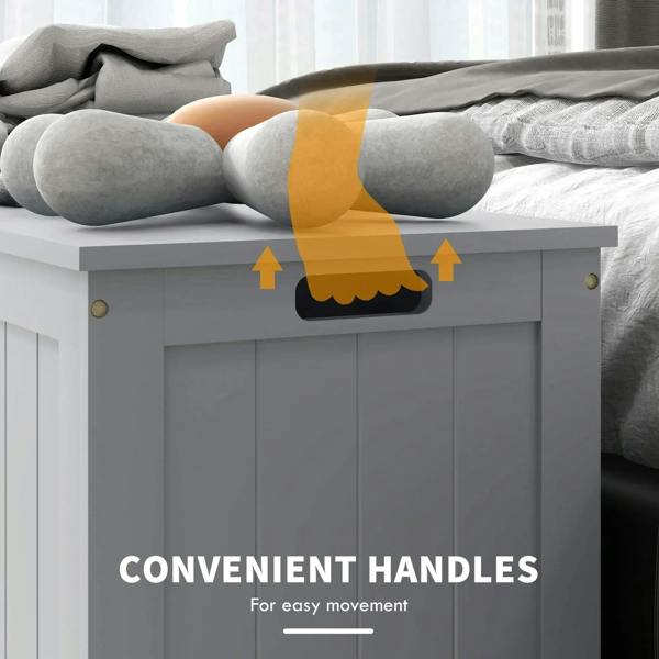 Grey storage trunk with cut-out handles and open lid over stuffed items