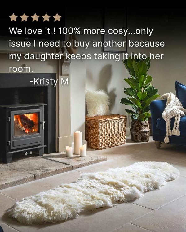 White Double Long Wool Sheepskin Rug in front of fireplace