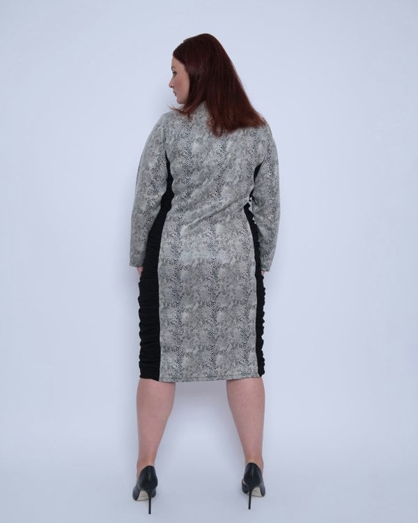 Women's Plus Size Black White Animal Print Bodycon Midi Vegan Leather Dress shown from the back, styled with black heels for a chic look.