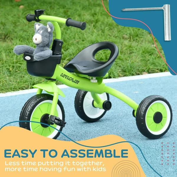 Green kids tricycle with black seat and handlebars, three lime wheels on pavement