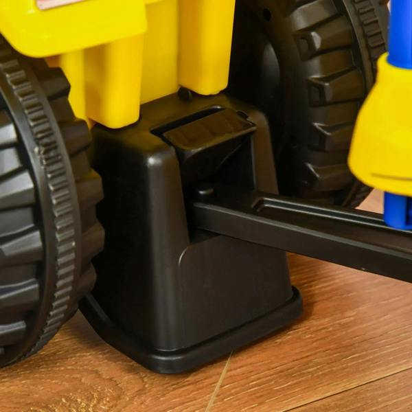 Black foot pedal platform on the yellow ride-on tractor walker