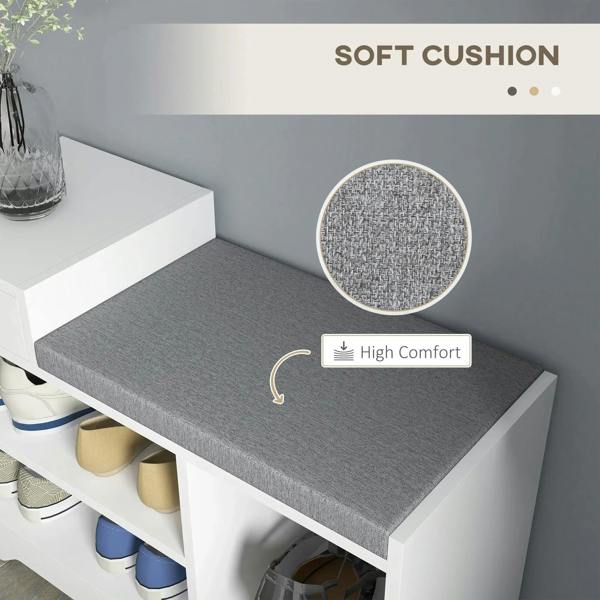 Gray cushioned seat on a white shoe bench with open shoe compartments