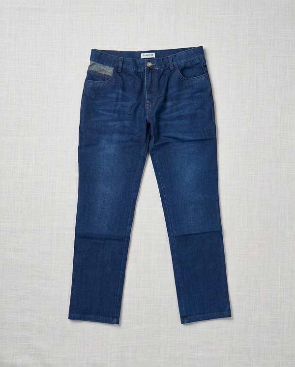 Blue jeans on a light gray textured background
