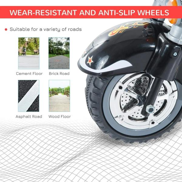 Front wheel of black ride-on motorbike trike with anti-slip tread and silver brake details