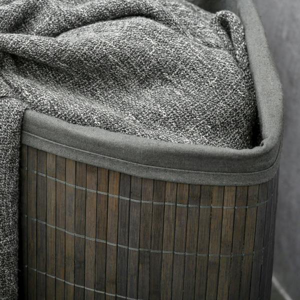 Grey bamboo laundry basket with lid, close-up of removable lining fabric trim