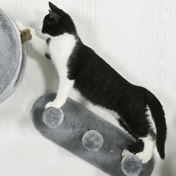 Grey wall-mounted cat tree scratching ramp with three pom pom pads
