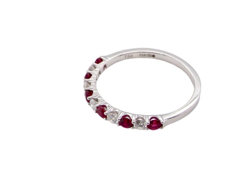 A white gold ruby and diamond eternity ring side view