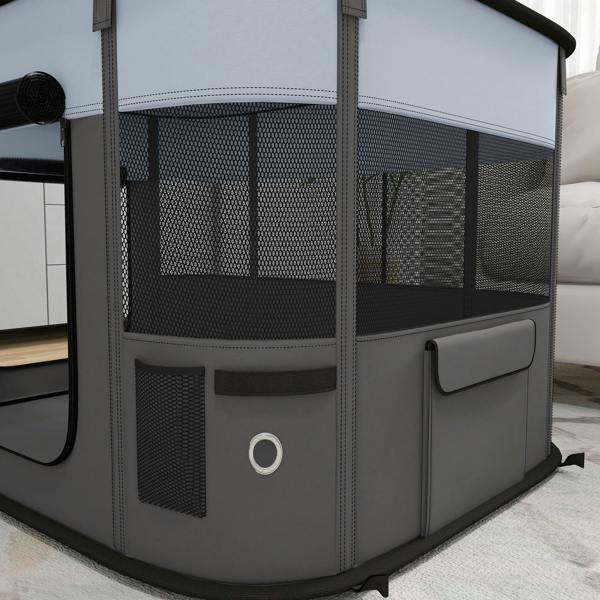 Grey foldable dog pen close-up with mesh side panels and front mesh window door