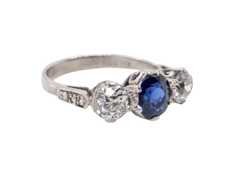 A 3 stone sapphire and diamond ring