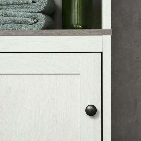 Antique white cabinet door with round black knob handle on lower storage
