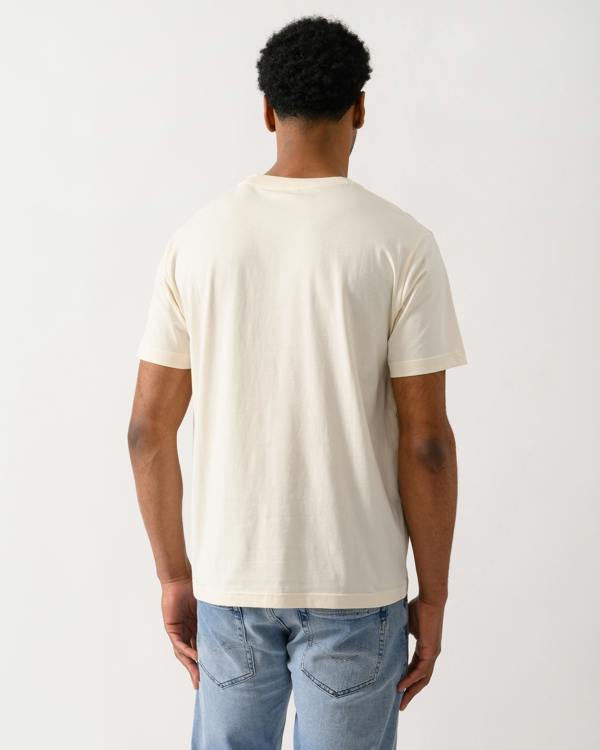 back shot of a model wearing a GANT Mens Graphic Short Sleeve T-Shirt in 130 Cream