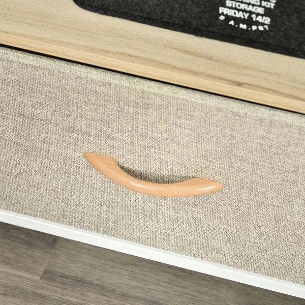 Grey fabric drawer with curved wooden handle on a maple wood-effect TV stand