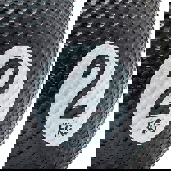 Black weight ball with a white label displaying '2 KG' on a white background