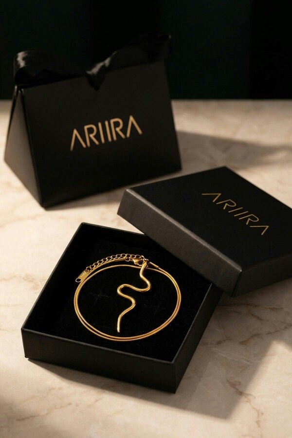 ARIIRA India Gold Tone Wavy Serpent Pendant