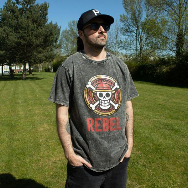 Charcoal stonewashed cotton T-shirt with skull “REBEL” front print on person