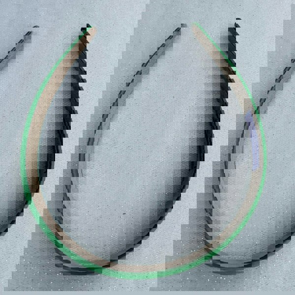 Green hairband, smooth satin finish, slim padded design, bold green colour, classic everyday accessory, simple minimalist headband
