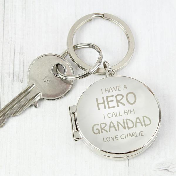 A high-quality metal keyring featuring a custom printed photo on one side and the engraved words "I Have A Hero, I Call Him Daddy" on the other. Shown with a secure attachment for daily use.