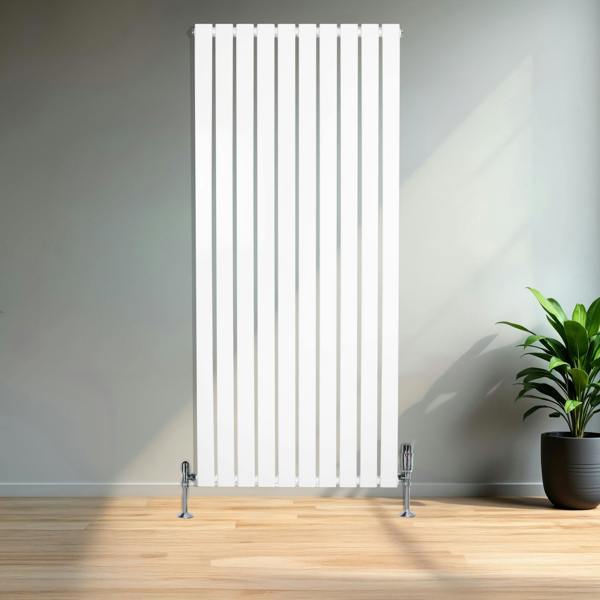 Sleek white flat single column radiator, 1600 x 700mm, featuring vertical lines and chrome valves, set against a modern interior with a potted plant
